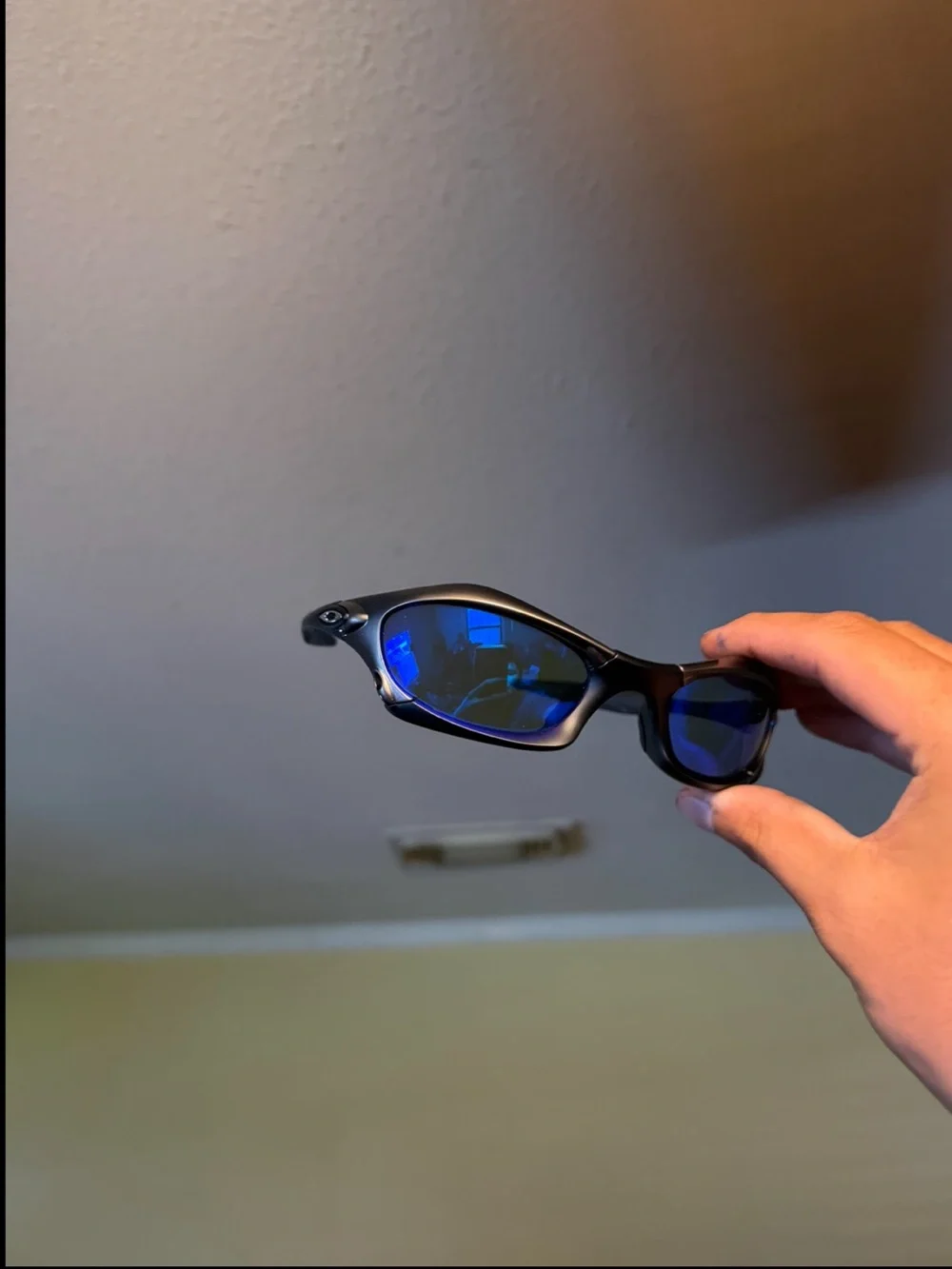 Black Sunglasses with Blue Mirrored Lenses Oakleys